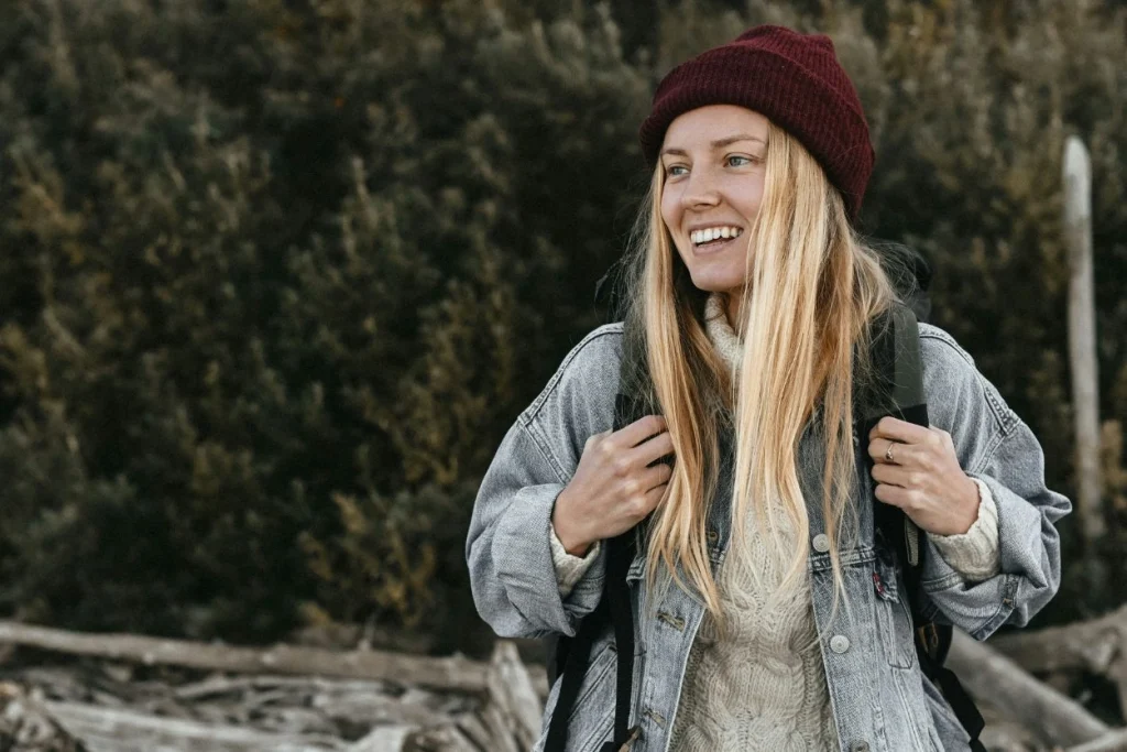 "Woman wearing a casual denim jacket with a backpack, ideal for a relaxed yet stylish look."