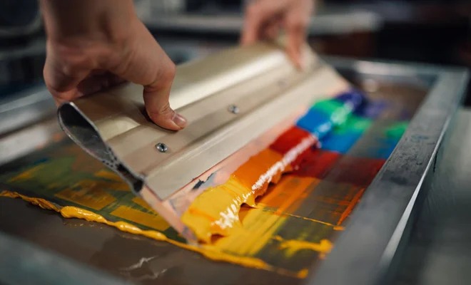 Screen printing process for custom T-shirts with colorful ink application